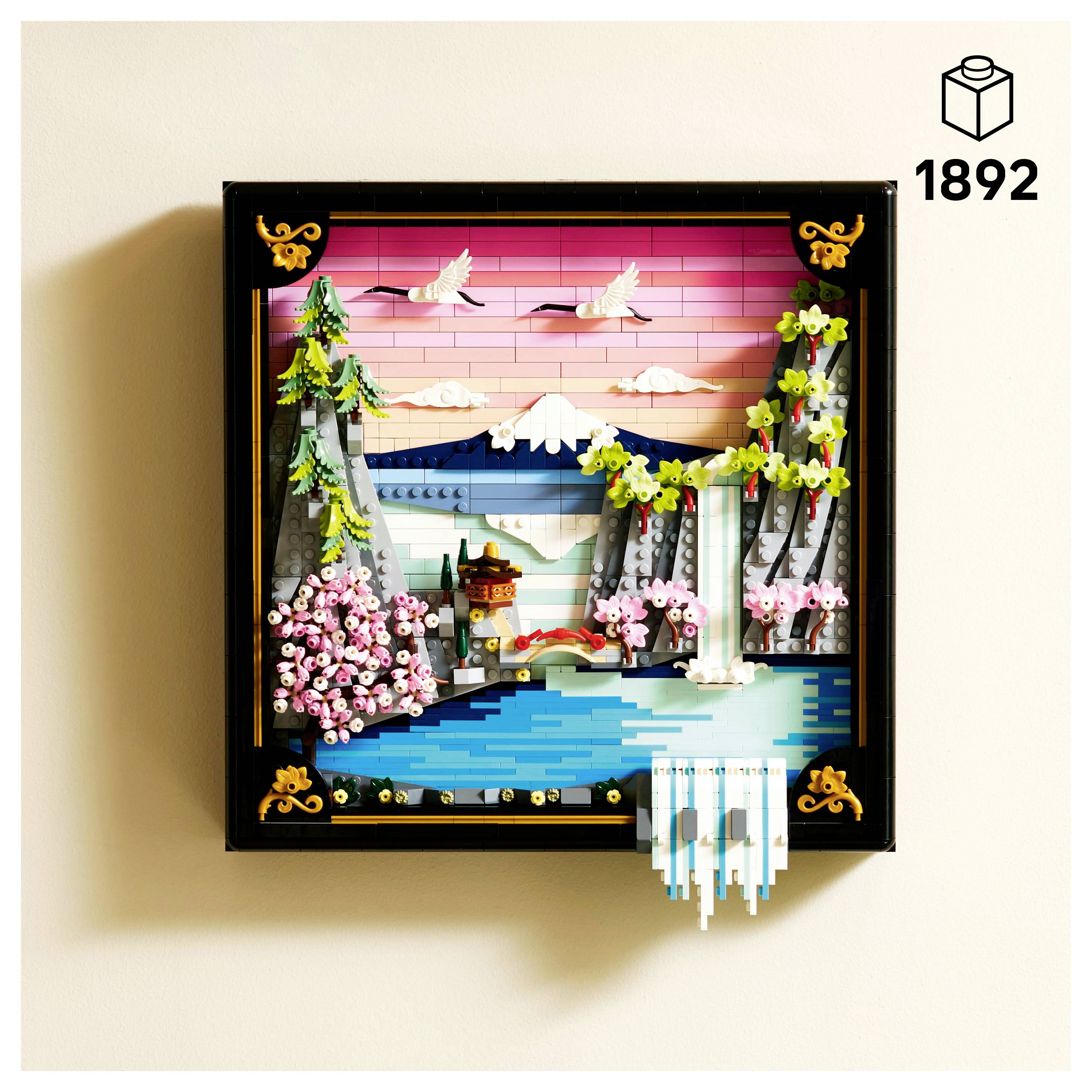 'Lego diorama with cherry blossoms, waterfall, bridge, and mountain under a pink sky, featuring intricate details and vibrant colors.'