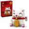 A LEGO set featuring a buildable white cat with a red collar and gold medallion, designed to resemble a traditional luck-bringing figure.