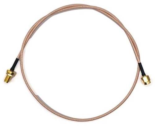 A coaxial cable with gold-plated connectors on each end, coiled in a circle.
