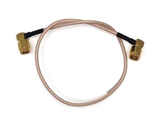A coiled RF cable with gold-plated connectors on both ends, used for connecting radio frequency equipment.