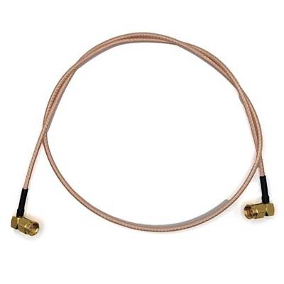 A coaxial cable with SMA male connectors on each end is coiled in a loop. The cable has a braided, copper appearance.