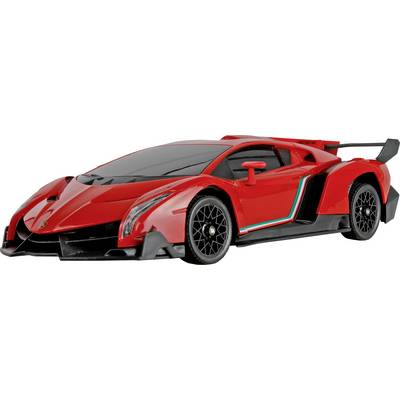 A sleek, red sports car with black accents and aerodynamic design, featuring distinctive wheels and a rear spoiler, captured in profile.