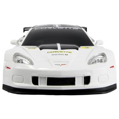 'A white toy race car, styled as a Corvette, with detailed headlights, a hood design, and branding. Front view showing grille and windshield.'