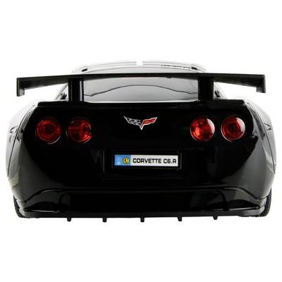 The image shows the rear view of a black Corvette C6.R model car, featuring red taillights and a prominent license plate reading 'CORVETTE C6.R'.