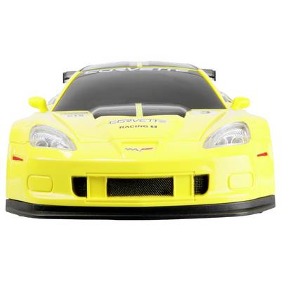 A yellow sports car model with a sleek design and 'Corvette' branding on the hood and windshield. The car is stationary, viewed from the front.