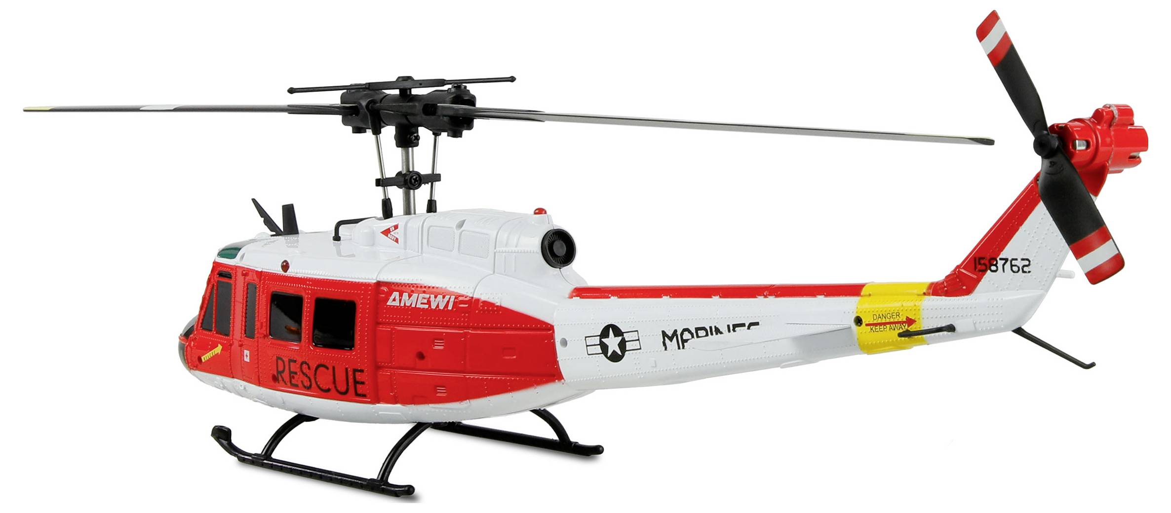 A model rescue helicopter with red and white markings, featuring the words 'RESCUE' and 'MARINES' on the side, with a visible rotor and tail.