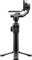 A black handheld camera gimbal with a small display screen, adjustable knobs, and tripod base, designed for stabilizing video capture.