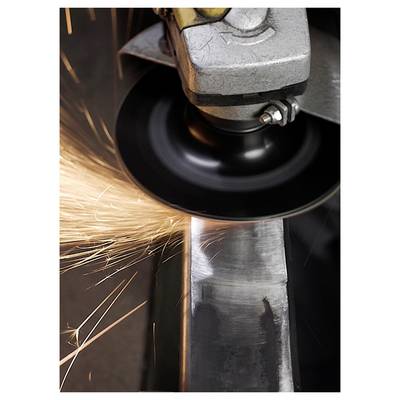 A metal grinder creating sparks while smoothing a steel edge, illustrating a metalworking process. Close-up view showing the friction.