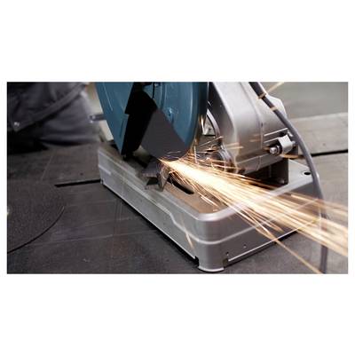 A metal cutting saw emits bright sparks as it cuts through a piece of metal, highlighting industrial activity and precision engineering.