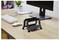A desk setup with a computer monitor, keyboard, mouse, plant, and a dual laptop holder placed on a wooden desk surface.