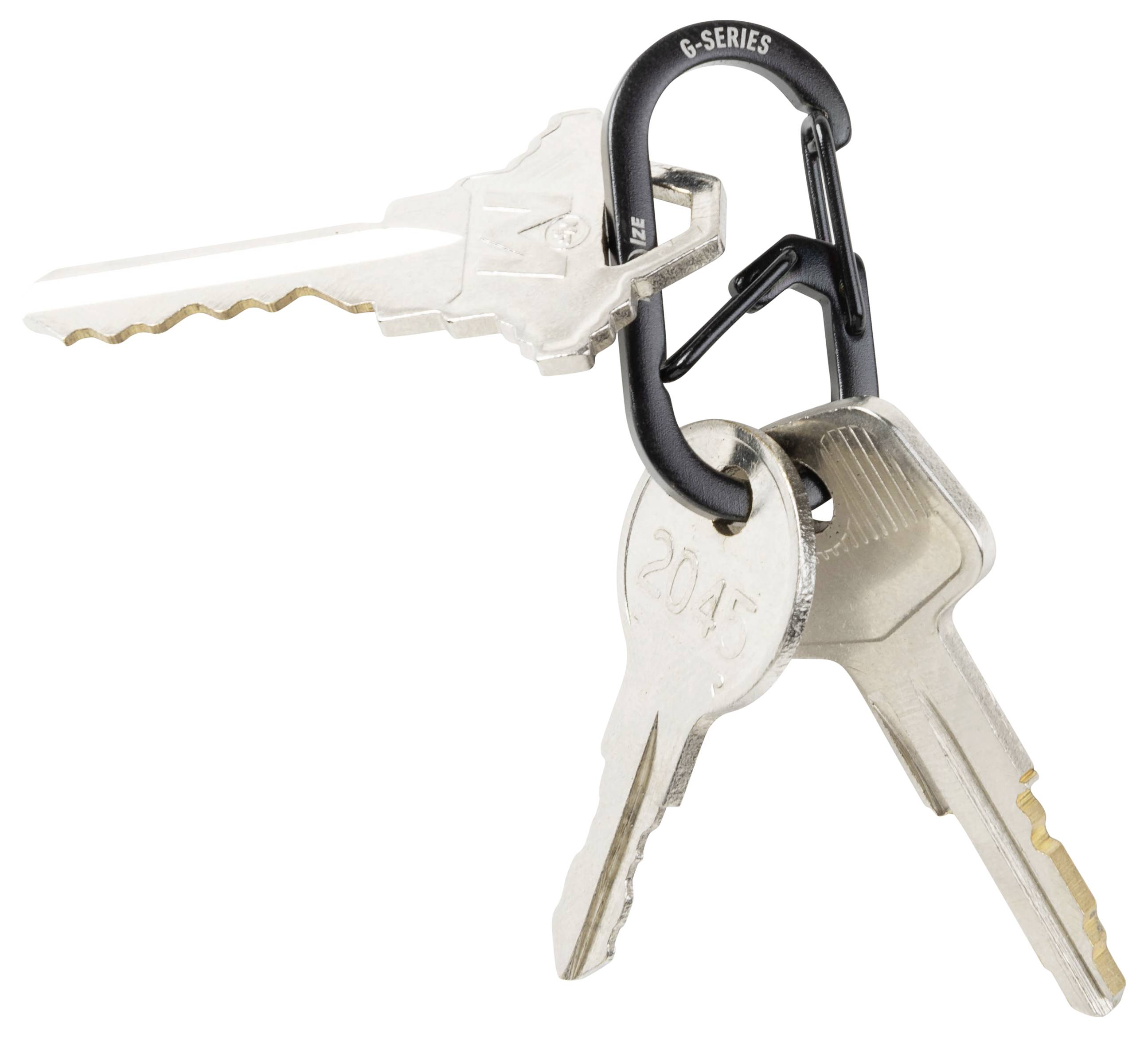 Three metal keys are attached to a small black carabiner, isolated on a white background.