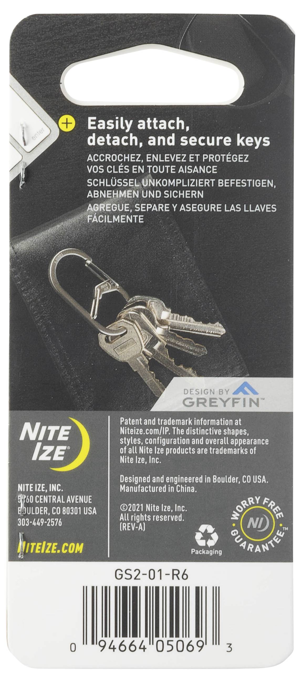 'Back of product package showing instructions: Easily attach, detach, and secure keys. Includes company contact information and barcode.'