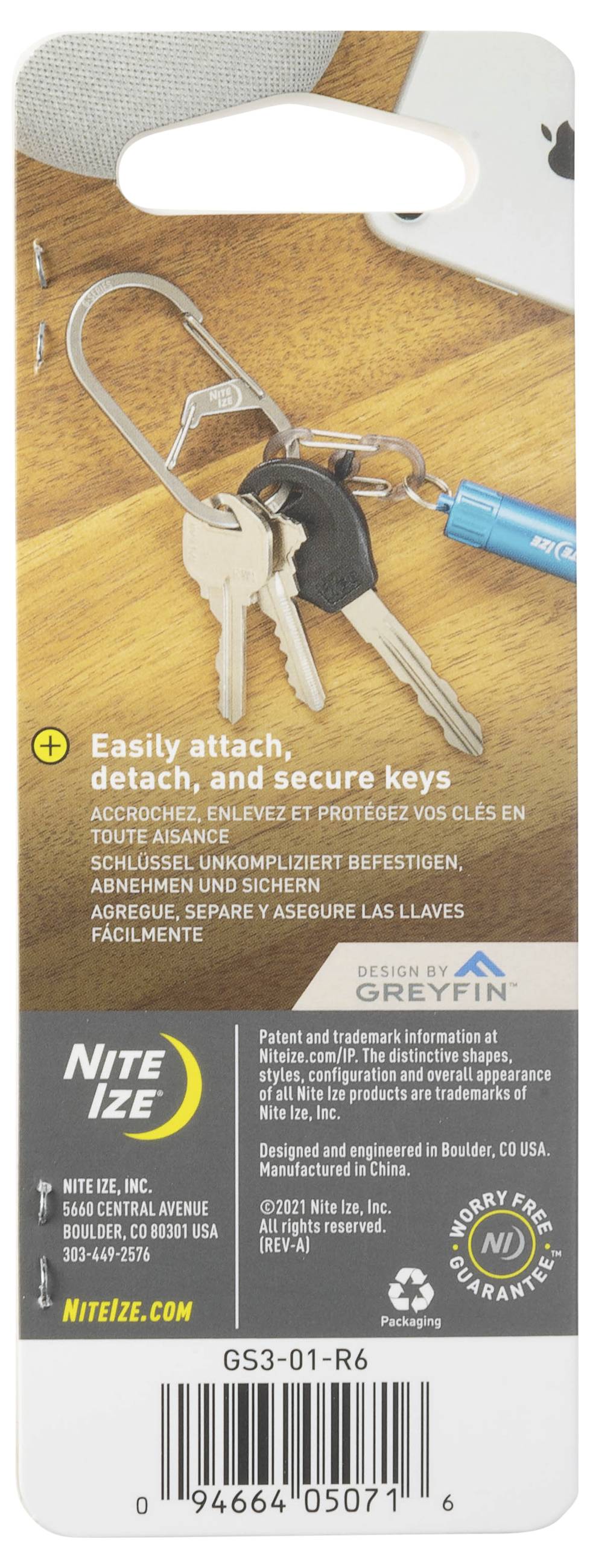 Packaging for Nite Ize keychain; shows keys on a clip. Text: 'Easily attach, detach, and secure keys'. Recycling and warranty info included.