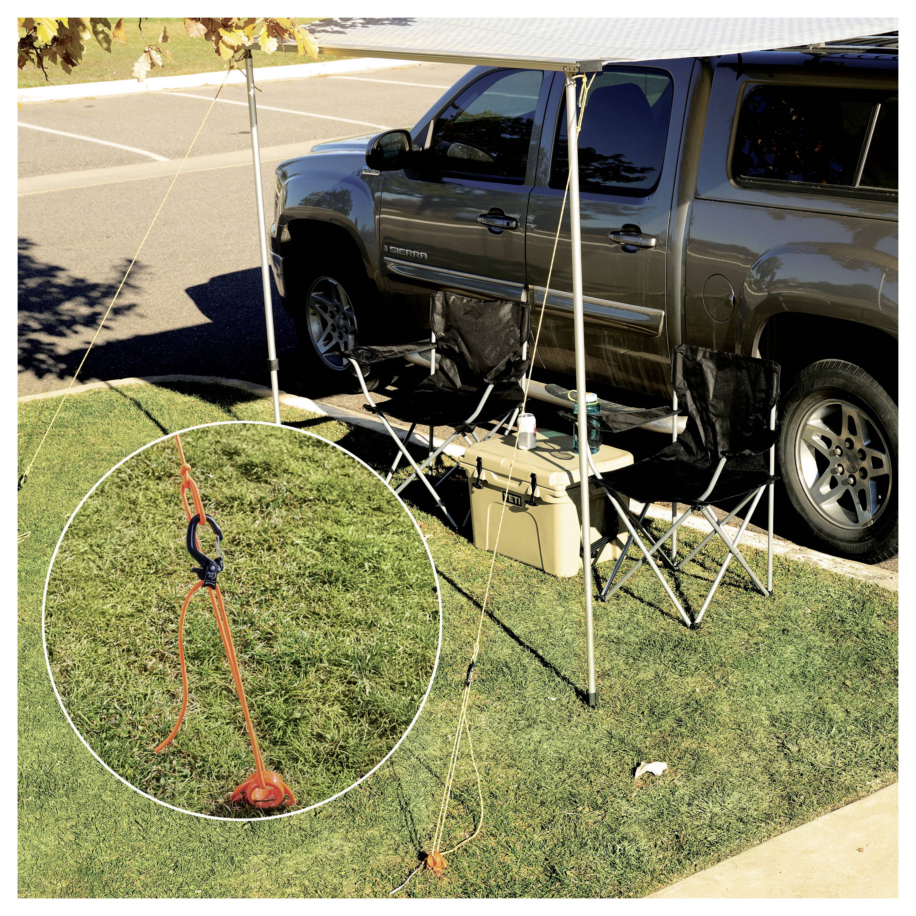 A camping setup beside a parked truck includes two chairs under a canopy. An inset highlights a tied-down tent rope with stakes.
