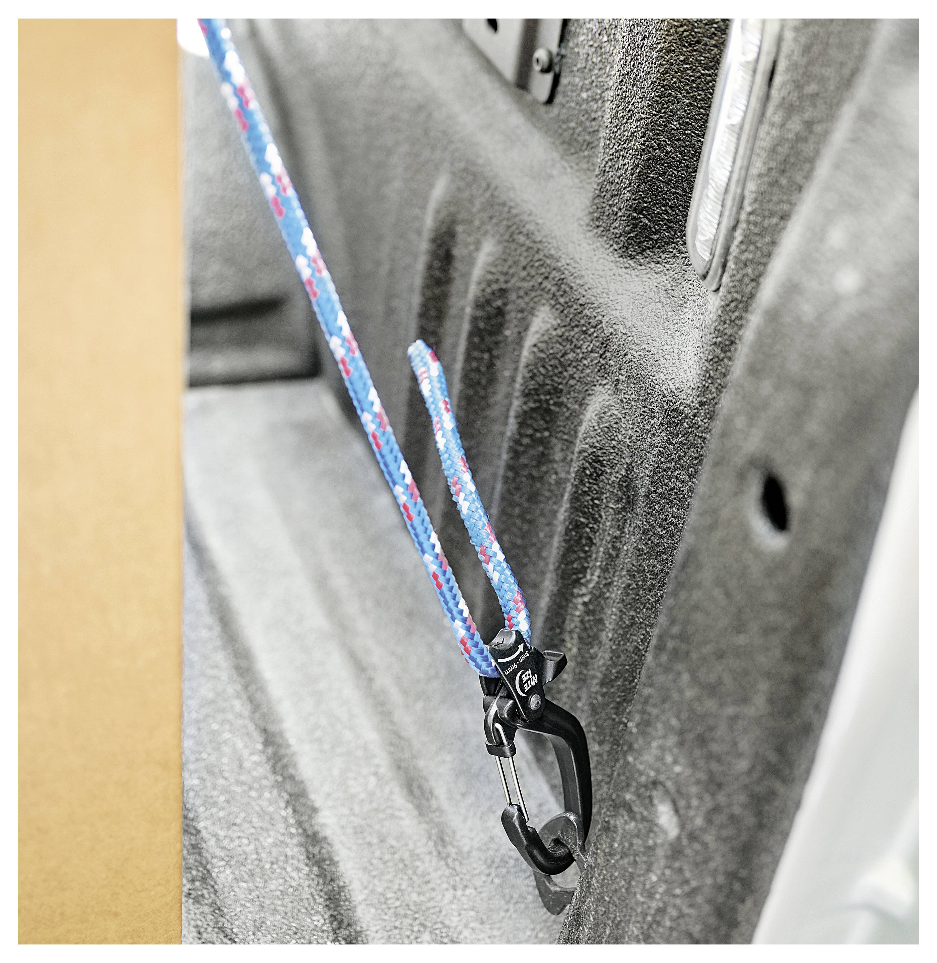 A bungee cord secured in a car's interior with a hook. The background shows a textured car surface, indicating vehicle storage use.