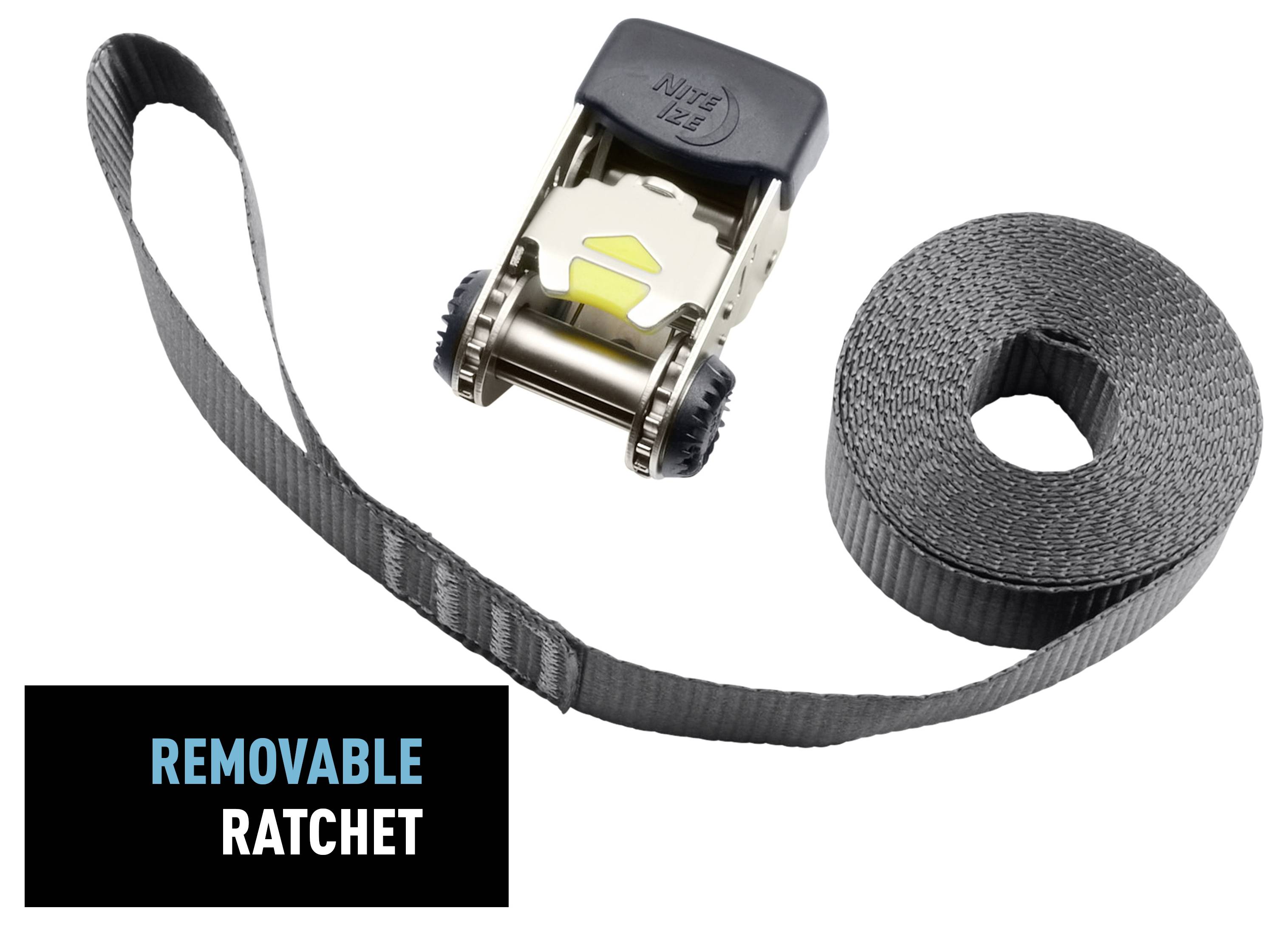 A black and gray removable ratchet with a long, coiled strap beside it. The strap and ratchet are used for securing items tightly.