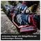 Man wearing gloves uses a chainsaw to cut a branch. Text in image: 'Slender design with storage surface for two-handed use'.