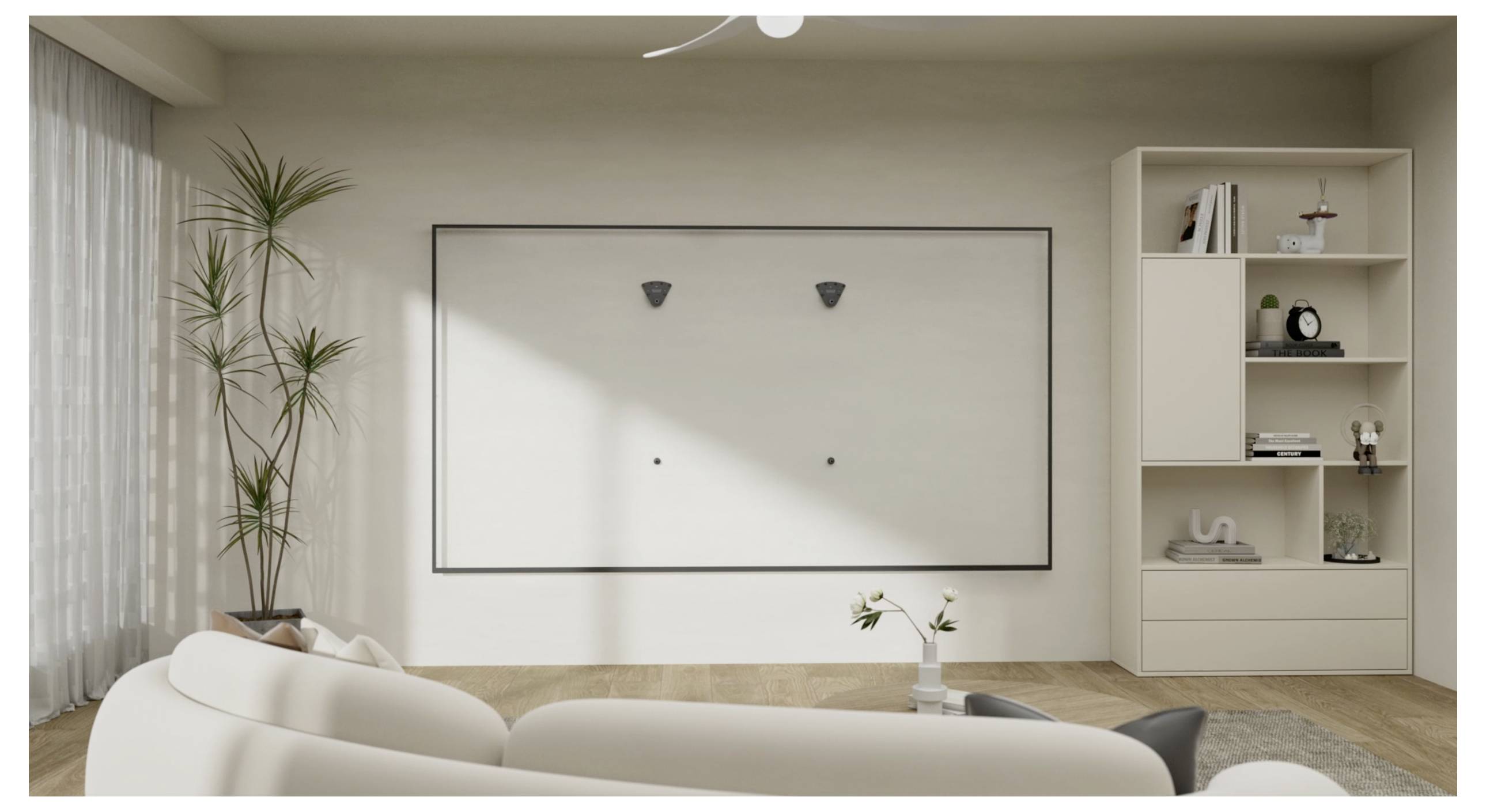 Modern living room with a large white sofa, wall-mounted TV, tall plant, and shelves with decor. Bright, natural lighting fills the room.