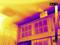 A thermal image of a room's ceiling and exit sign shows temperatures ranging from 10.3°C to 24.2°C, highlighting heat distribution.