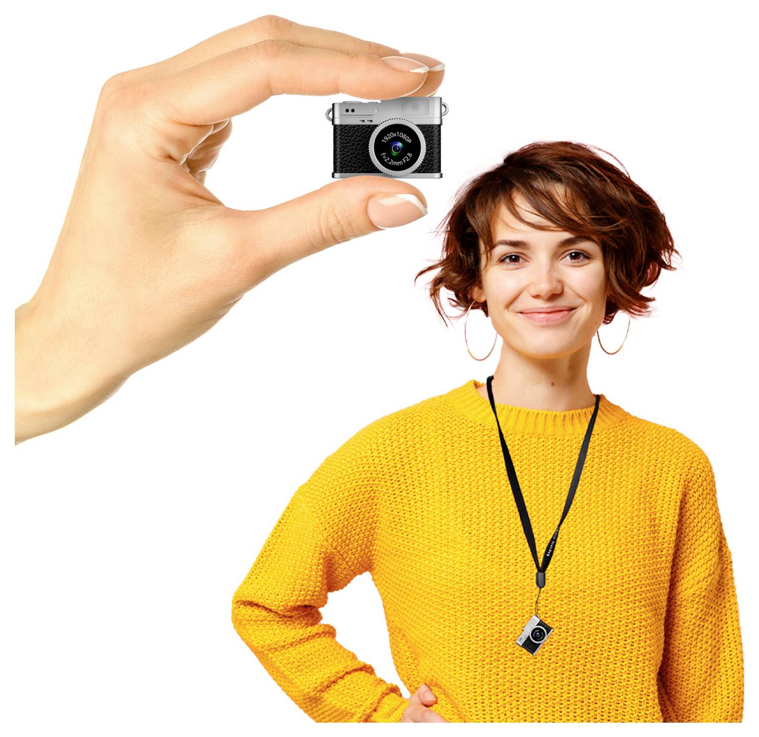 A woman in a yellow sweater smiles while holding a small camera, which is also shown enlarged by a hand in the upper left.