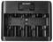 Battery charger with multiple slots labeled 'Voltcraft VC-BC-5100', featuring connectors for charging various battery types.
