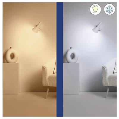 'Living room split image; left warm light with yellow hue, right cool light with blue hue. Features a vase on a pedestal and part of a sofa.'