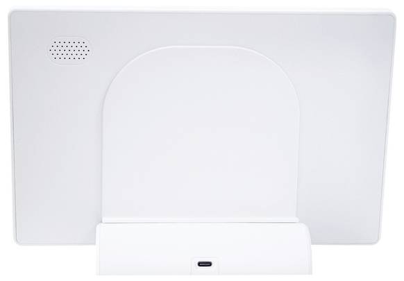 The image shows the back view of a white electronic device stand with a speaker and a USB-C port at the bottom center.