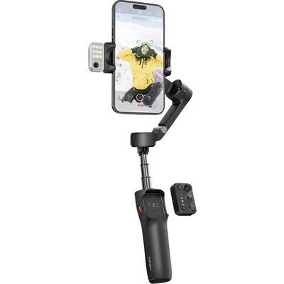 A smartphone mounted on a gimbal capturing a video of a person in a snowy environment, with controls for zoom and lighting visible.