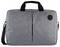 A gray fabric laptop bag with a handle and shoulder strap, featuring a simple design and a round black logo on the front.