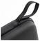 Close-up of a black textured fabric bag corner with a sturdy strap loop for carrying or hanging.