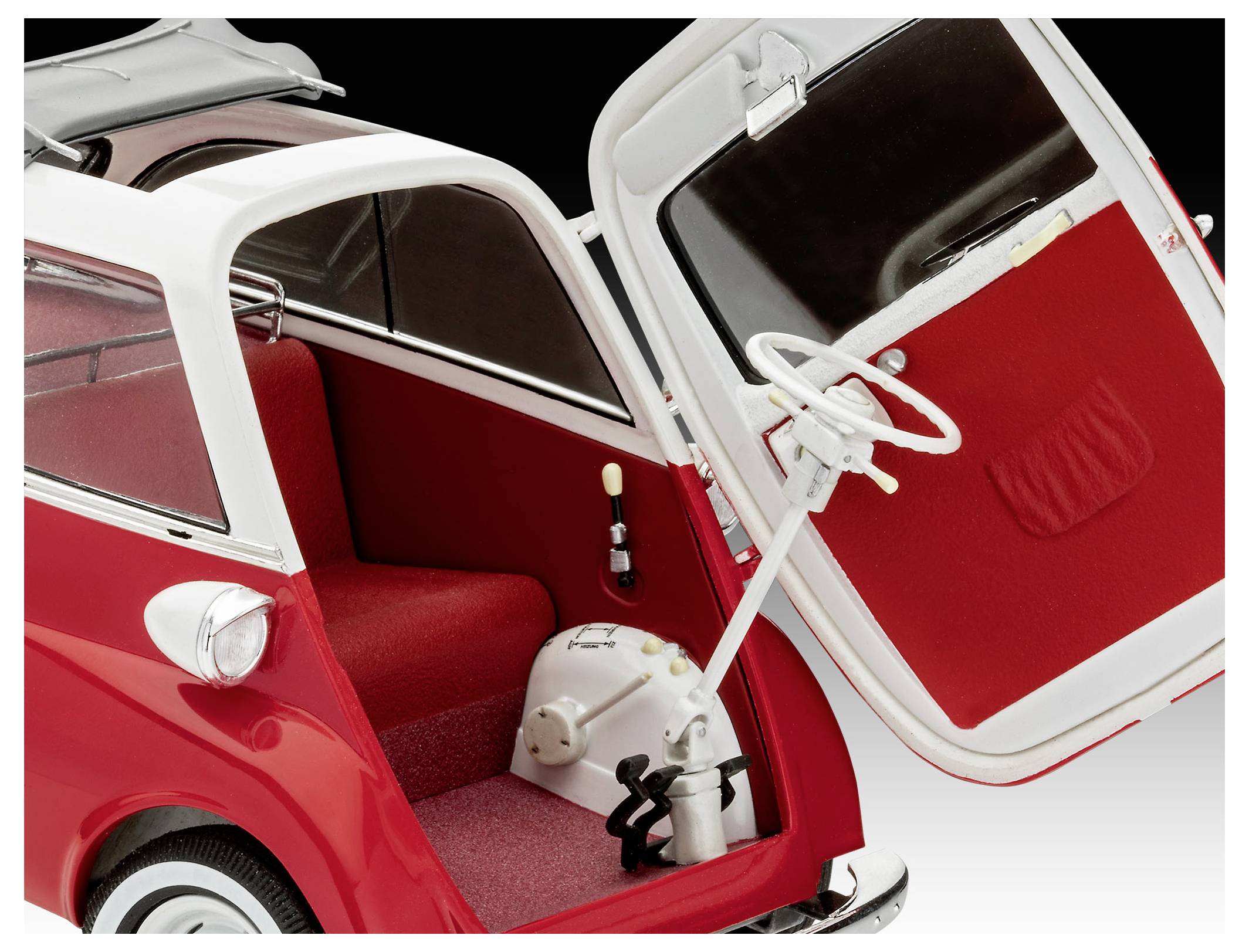 A red three-wheeled microcar with an open front door revealing a red interior, single seat, and steering wheel. The design is vintage.