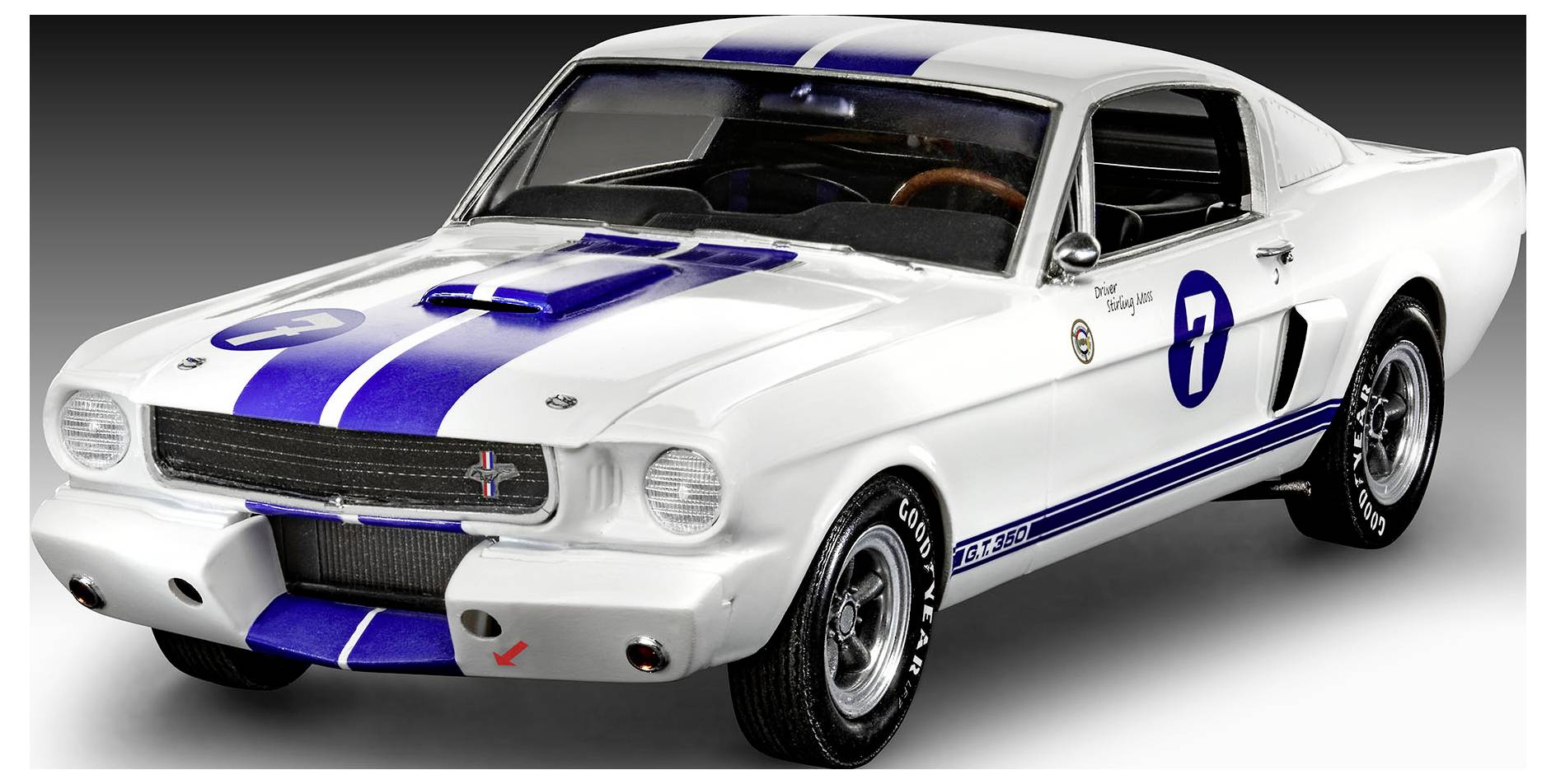 A white classic race car with blue racing stripes and the number '7' on the side, displayed against a dark gradient background.