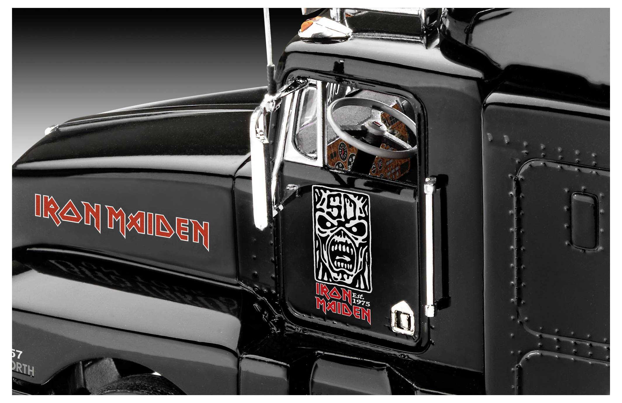 A black truck cab featuring the 'Iron Maiden' logo and artwork on the door, viewed from a side angle.