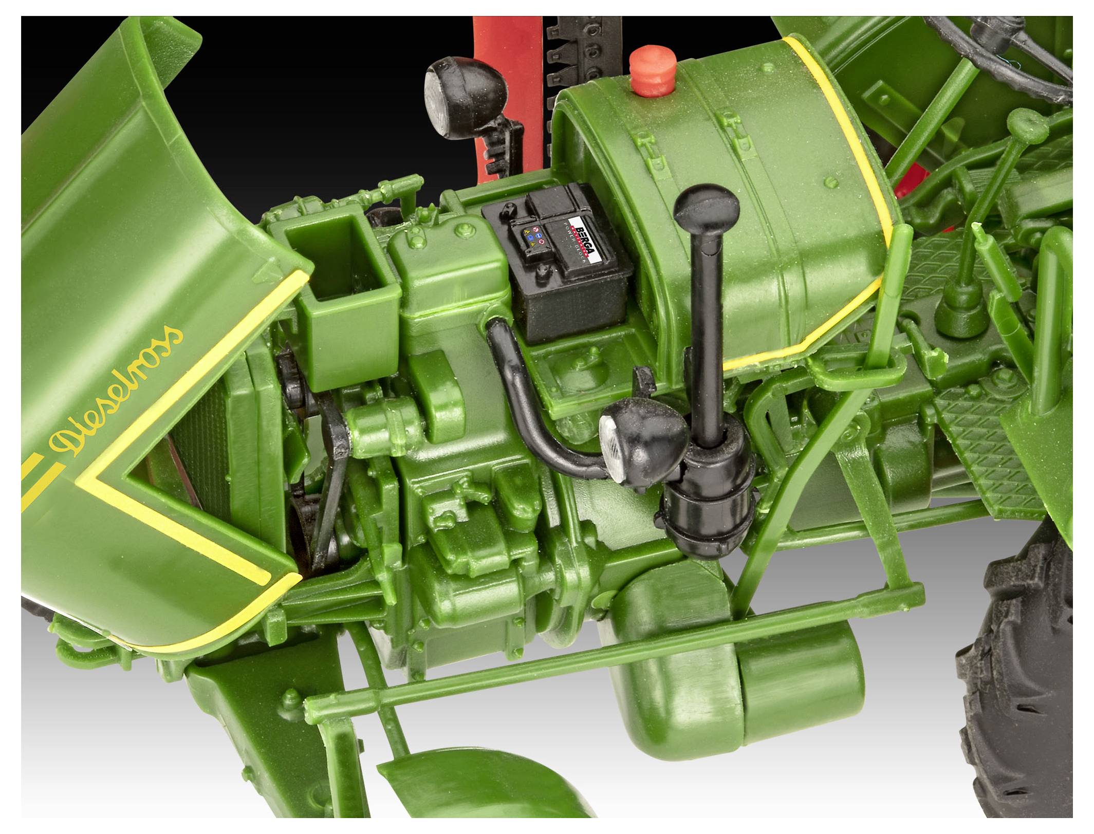 Close-up of a green vintage tractor's detailed engine components, showcasing levers, a toolbox, and mechanical parts with intricate design.