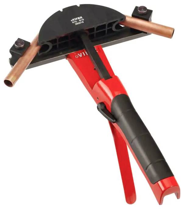 Handheld copper pipe bending tool with red-and-black handles, shown holding two copper tubes in a curved black head.