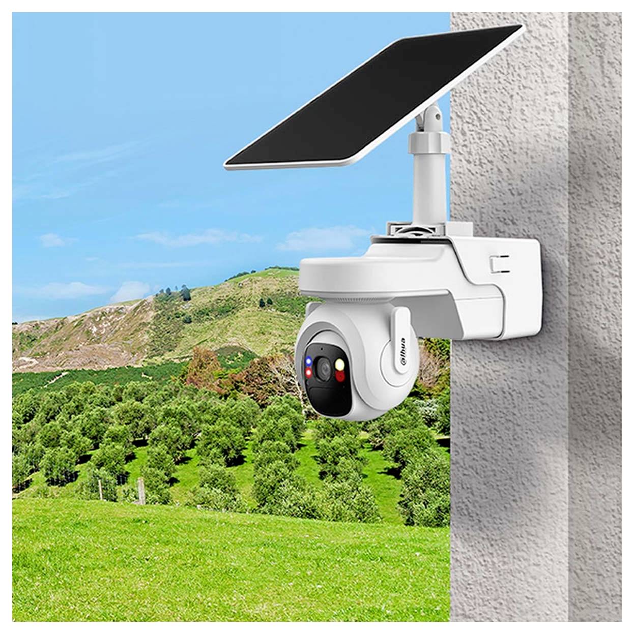 Security camera with solar panel facing a scenic landscape of hills and trees, mounted on a wall.