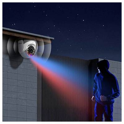 A surveillance camera mounted on a building captures an image of a person wearing a hoodie, highlighted by a beam of blue and red light.