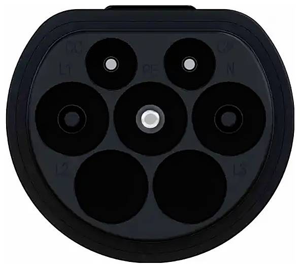 Close-up of a Type 2 electric vehicle charging connector showing six round contacts arranged in a semi-circular pattern.