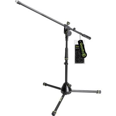 A black and green adjustable microphone stand with an attached tag showing the brand 'Gravity'. The stand has solid legs for stability.