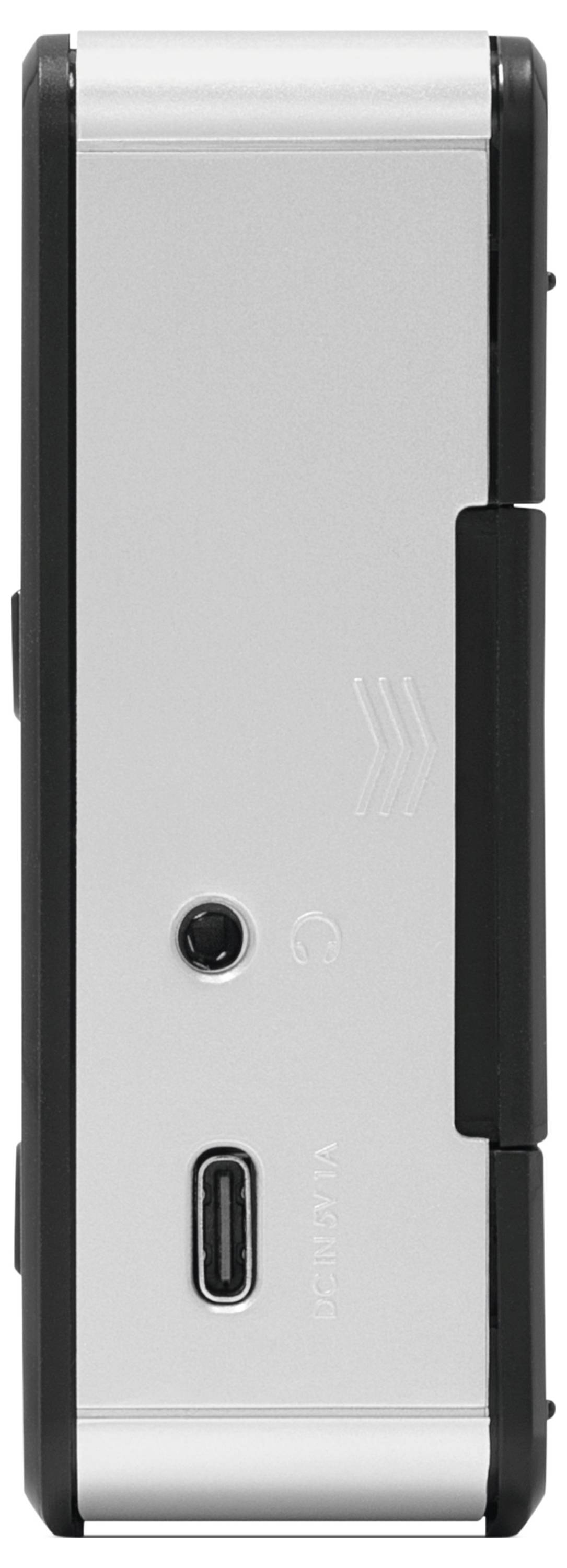 A close-up of a device's side, featuring a USB-C port and a headphone jack on a metallic surface.