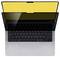 A laptop with a keyboard visible, its screen displaying a bright yellow color. The screen appears partially folded over the keyboard.