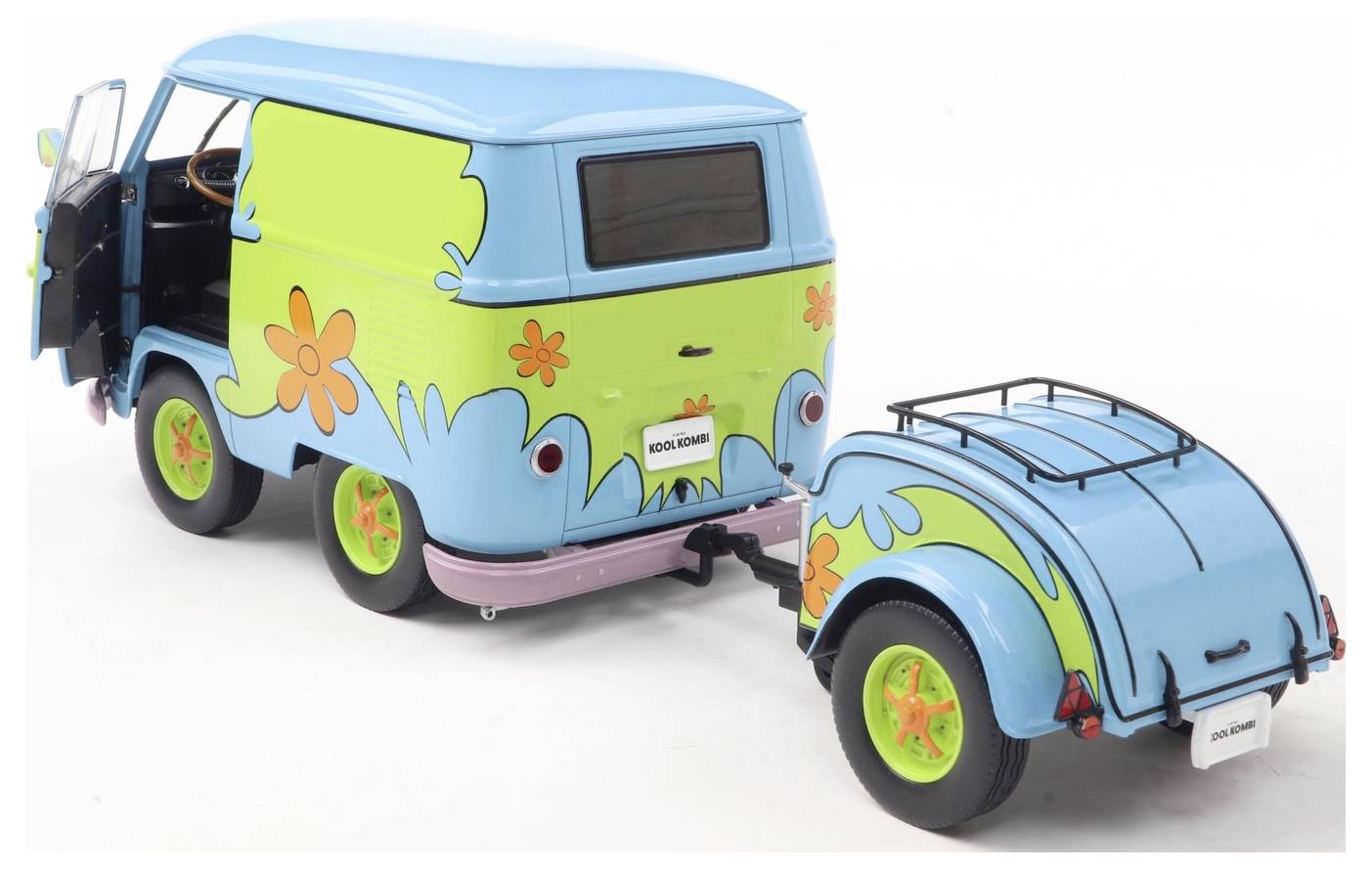 A colorful, vintage-style van with flower patterns and a matching trailer, resembling a 1960s theme.