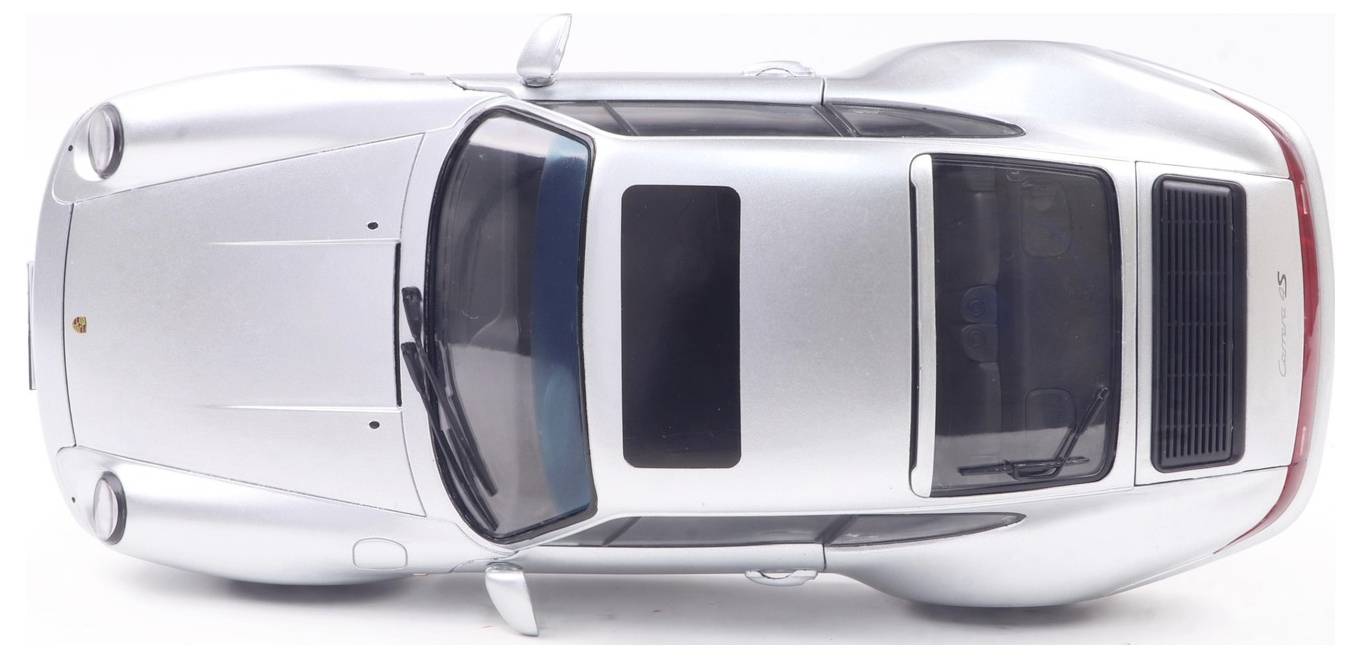 A silver car viewed from above, showcasing a sleek design with a sunroof.