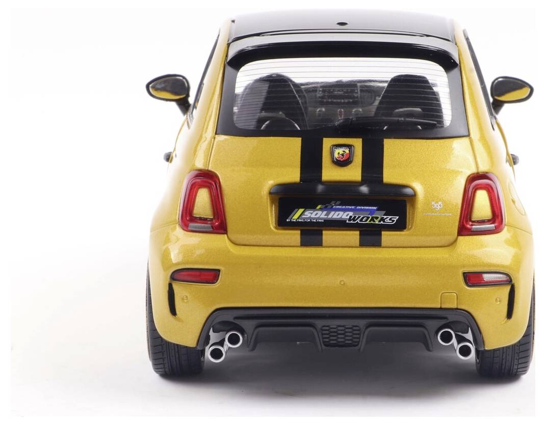 A yellow sports car viewed from the rear with black racing stripes, dual exhaust, and a branded license plate.