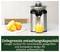 Juicer on a table with oranges and freshly squeezed juice beside it. Text: 'Unlimited juicing capacity'.
