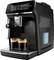 A black Philips espresso machine with a touch screen interface is making two cups of coffee, with steam rising from the drinks.