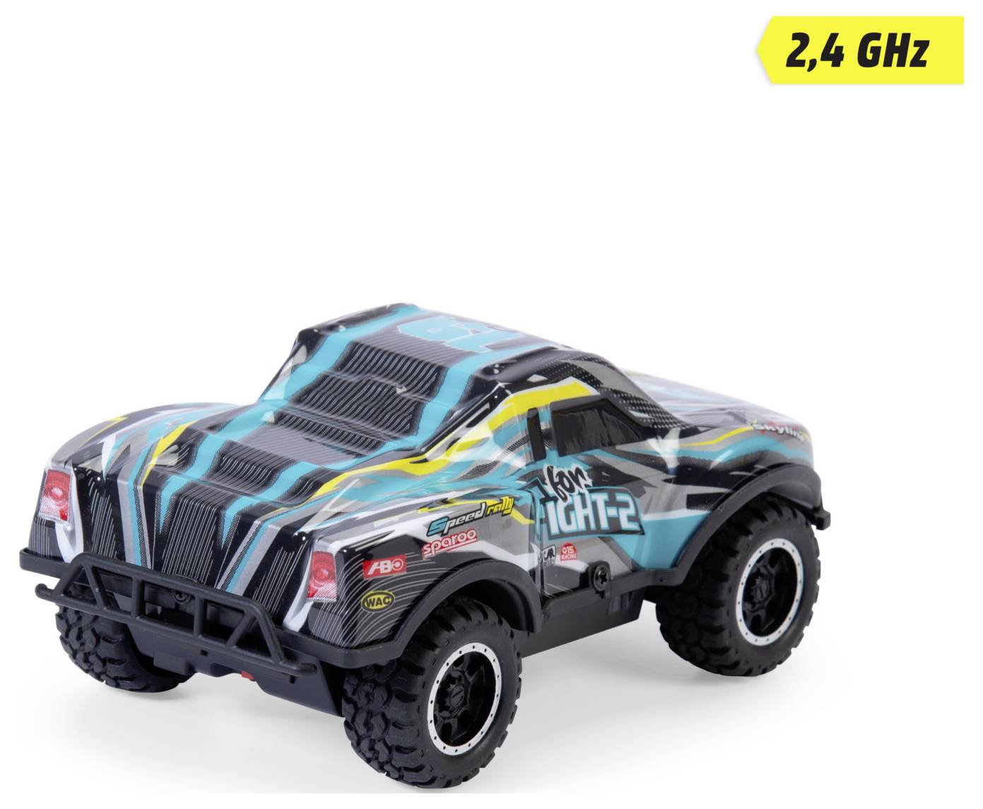 A black and blue toy truck with a graphic design of stripes and the text 'Iron Tight-2' on the side. A '2,4 GHz' label is in the corner.