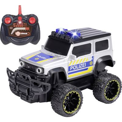 A remote-controlled toy police SUV with large wheels, police decals, and a rooftop siren. The remote is visible with joystick controls.