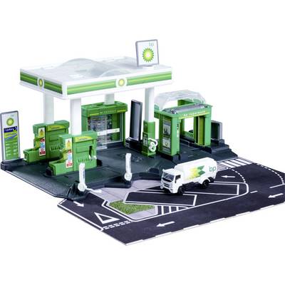 A model toy gas station with a BP logo, featuring green fuel pumps, a mini convenience store, car wash, and a small delivery truck.