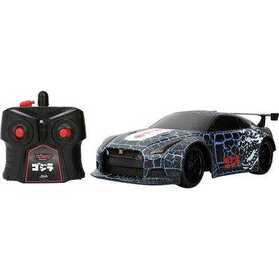 A black and blue remote-controlled car with a spoiler, featuring a matching black controller with red buttons.